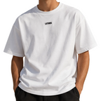 Model wearing a white LSTHRS T-shirt with embroidered chest logo